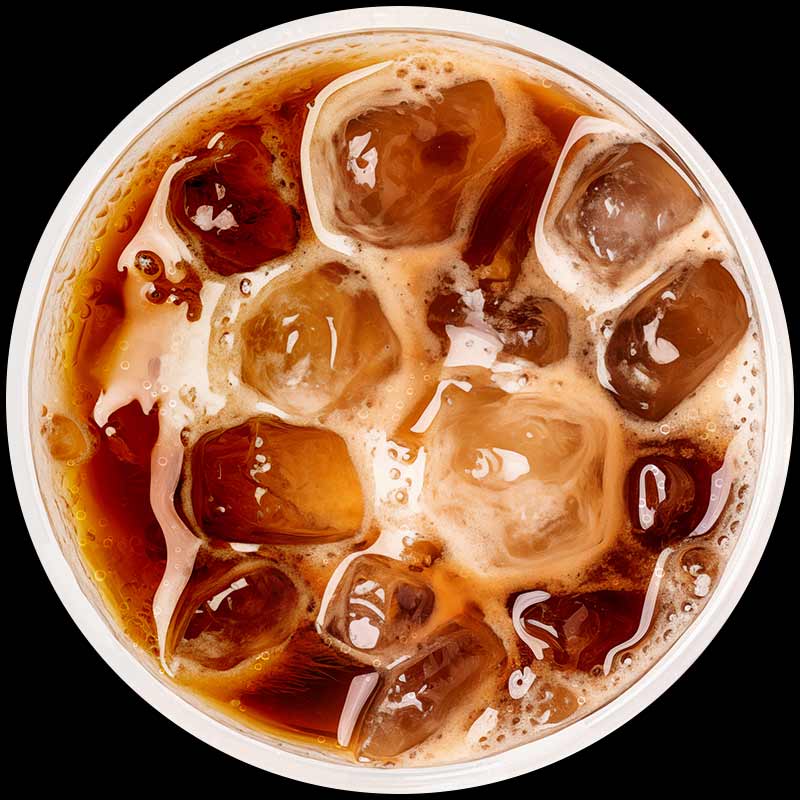 A glass of dark-brown soda with ice cubes seen from above.